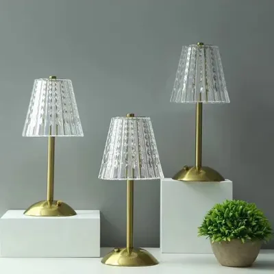 We offer lighting that adapts to your life. This trio of cordless table lamps features a classic pleated crystal design, but with modern rechargeable and touch-operated functionality for complete portability and ease of use.