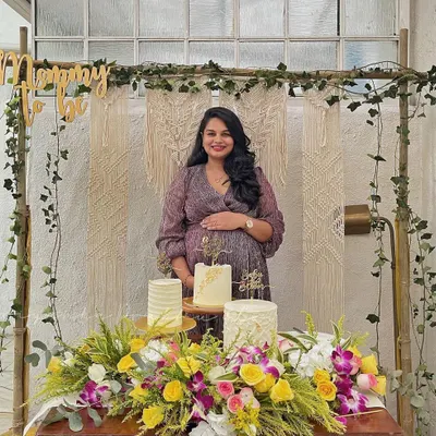 My beautiful mommy-to-be at her special baby shower. I designed this cozy and stylish corner with a macrame backdrop, lush florals, and a custom 'Mommy to be' sign to make her feel celebrated.