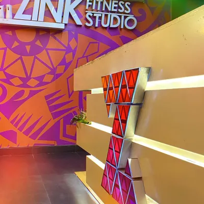 A close-up of our reception desk and the vibrant, custom-designed wall art that welcomes you into the studio.