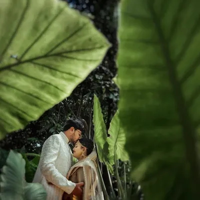 An intimate portrait framed by giant, lush leaves. I often use natural elements to create unique compositions that make you feel like you are in a world of your own.