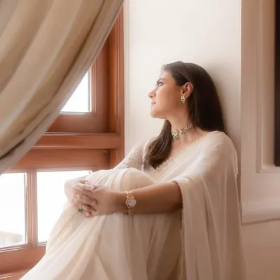 Simplicity can be the ultimate statement. I styled this classic white chiffon saree with a delicate hand-embroidered blouse and a simple choker, creating a look of timeless elegance inspired by iconic cinematic moments.