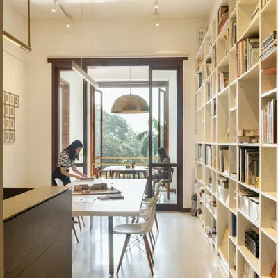 Our office is a space for co-creation. We follow a hybrid model with no designated desks, encouraging a shared sense of ownership. The long central table serves as a hub for team discussions, material exploration, and collaborative work.