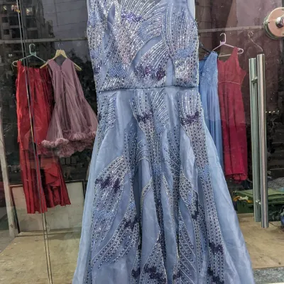 This organza blue handwork gown is perfect for an engagement. It comes with a detachable ball gown skirt, so you can have a grand entrance and a more relaxed look for dancing later.