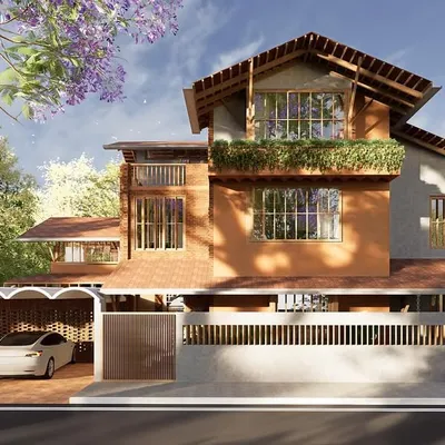 This home fuses vernacular and contemporary design, incorporating exposed brick and a sloping tiled roof for passive cooling. Large openings and a perforated brick screen ensure natural ventilation and privacy, reinforcing the home’s climate-responsive character.
