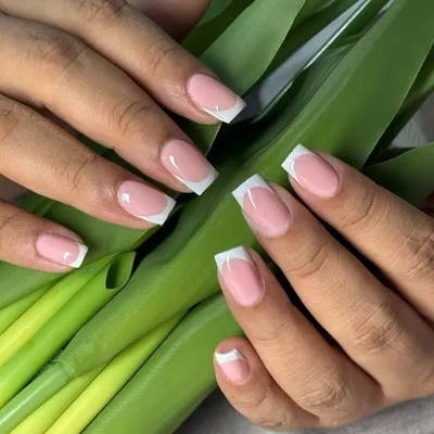 A perfect execution of the classic French manicure on square-shaped nails. This look is all about precision, with a clean smile line and a flawless finish that offers timeless sophistication.