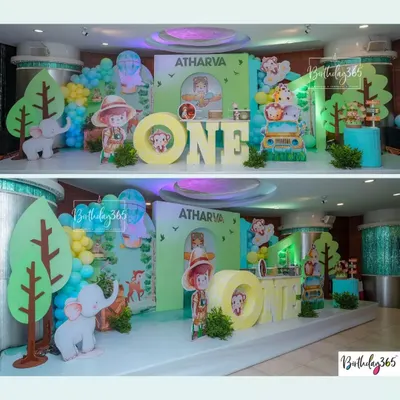 A roaring good time for Atharva's first birthday! We created a full jungle safari experience with friendly animal cutouts, a safari jeep, and lush green decor.