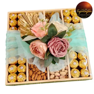 A premium gift hamper filled with Ferrero Rocher chocolates, almonds, and pistachios. Wrapped in love and delivered with grace, it's perfect for any celebration.