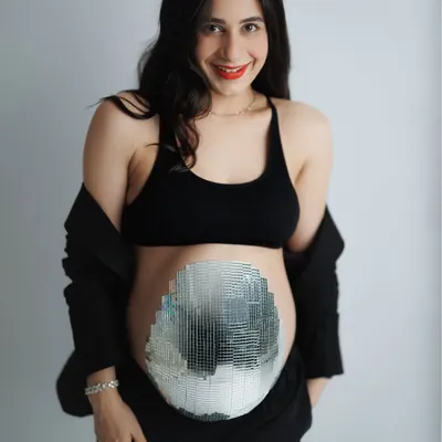 This mama-to-be wanted a session that was both cozy and quirky. Her family even helped create this amazing mirrorball belly. It was a day full of joy and celebrating her journey.