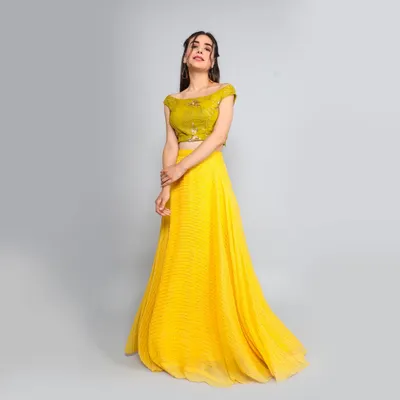 A full-length shot of a model in a vibrant yellow lehenga. I capture movement and flow in ethnic wear to showcase the garment's drape and design, perfect for festive collection lookbooks.