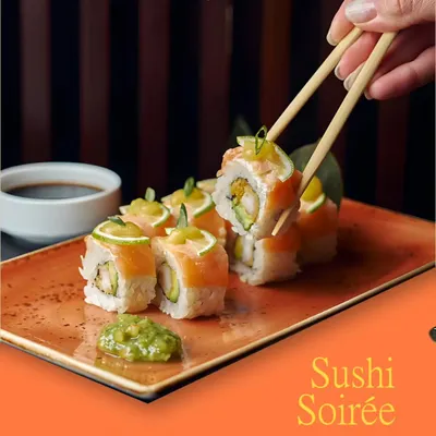 A Sushi Soirée for your event. From handcrafted rolls to umami bites, our sushi catering brings a touch of Japanese elegance and sophistication, featuring fresh salmon and avocado rolls with a zesty topping.