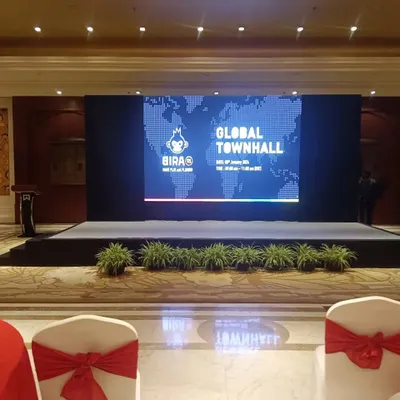The main stage for the BIRA 91 Global Townhall. A clean, branded setup is key for professional events, and I ensure the tech and design reflect the company's global stature.