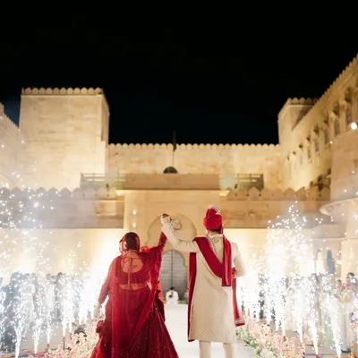 A truly royal varmala at the stunning Suryagarh palace in Jaisalmer. We planned this destination wedding to feel like a modern-day fairytale, complete with fireworks and grandeur.