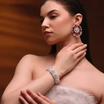 For this high-fashion jewelry shoot, we went with a clean, radiant look to let these stunning ruby and diamond pieces shine. The skin is polished and the makeup is minimal.