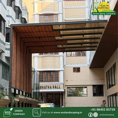 A view of the completed pergola at Akshatha Hall, showing how the structure creates a grand and sheltered entryway that enhances the building's facade.
