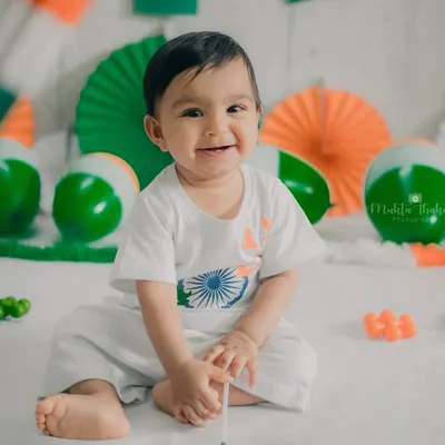 A big, joyful smile that lights up the whole frame. This is the kind of happy, candid moment I love to capture during a milestone baby photoshoot.