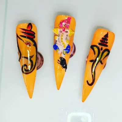 I am very proud of my custom Ganesha nail art, perfect for festivals. This set includes both detailed free-hand painting and a sculpted 3D Ganesha, showing the range of custom designs I can create for you on press-on nails.
