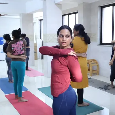A glimpse into our offline yoga camp, where students practice Gomukhasana (Cow Face Pose) arms. This stretch is excellent for opening the shoulders and chest, and our instructors provide personal adjustments to help students find the correct alignment.