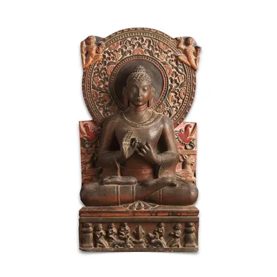 A magnificent 8th-century stone stele of Gautam Buddha from North India. The Buddha is depicted in 'dhyanasana' with his hands in the 'dharmachakra' mudra, seated on a throne with intricate carvings of worshippers and animals.
