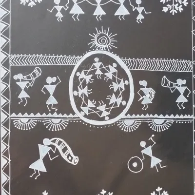 A classic Warli painting from Maharashtra. This tribal art uses simple stick figures in white paint on a dark background to depict scenes of daily life, rituals, and community celebrations.