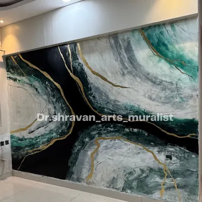 This large-scale granite mural features dramatic swirls of black, white, and green, shot through with veins of gold. It's a powerful statement piece that brings energy and luxury to the wall.