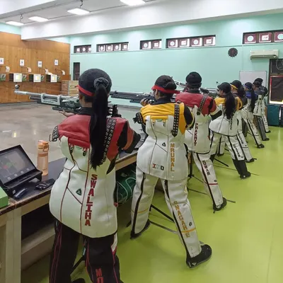 Our women athletes in a synchronized line of fire at our Vashi Centre. This image captures the intense focus and discipline instilled during our training sessions as they prepare for national competitions.