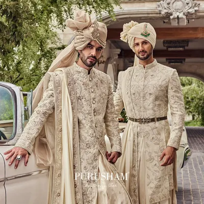The groom and his groomsman, dressed in my impeccable tailoring. I designed these coordinated ivory sherwanis to reflect a blend of style, brotherhood, and timeless charm.