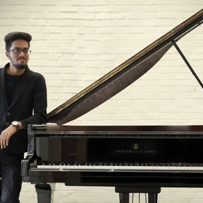 We are proud to have exceptionally talented teachers like Mr. Allaudin Shaikh on our team. Here he is with a beautiful Steinway & Sons grand piano before his solo recital at the prestigious NCPA. Our faculty consists of performing artists who inspire our students with their own musical excellence.