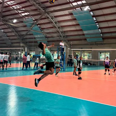 A player flies high for a spike during the IIT Mumbai tournament. Our teams consistently perform well and showcase their skills at local events.