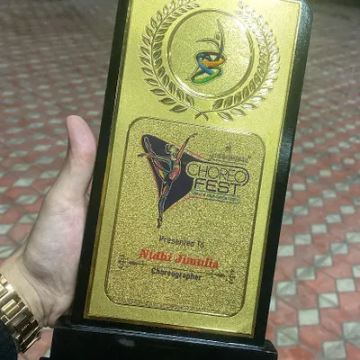 A close up of my Choreographer Achievement Award from Choreofeast. This trophy is a symbol of my expertise and recognition within the dance industry.