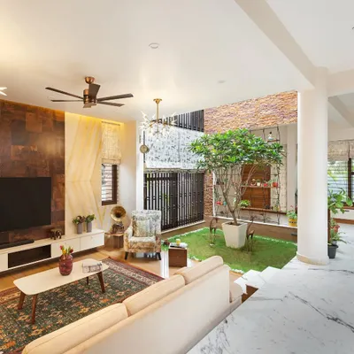 A view of the living room at our Twin Courtyard project, showing how the space is designed around the central green area. This layout ensures the home is always filled with natural light and a sense of openness.