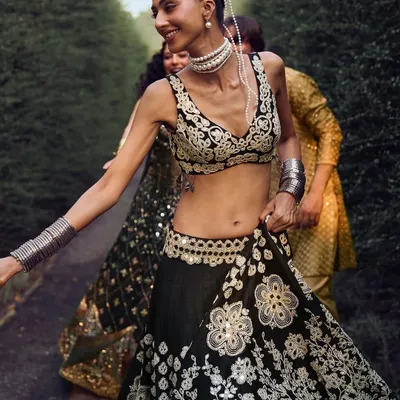A pearl-draped bun seen from the front, created for a campaign with designer Abhinav Mishra. The delicate pearls add a touch of royalty to the traditional ethnic wear.