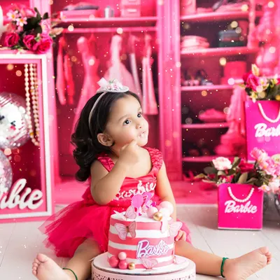 Welcome to the Barbie dream world! This vibrant, all-pink cake smash session is perfect for your little fashionista, complete with a themed cake and a closet full of dreams.