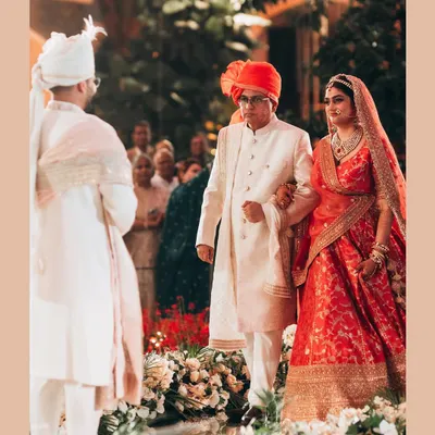 The bride's father walks her down the aisle. This is one of the most emotional moments of any wedding, and I focus on capturing the mix of pride, love, and nostalgia.