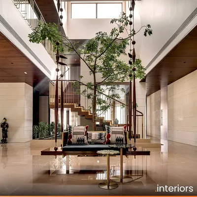 The Aangan residence in Ahmedabad reinterprets the traditional Indian courtyard home. This central space features a custom swing under a living tree, creating a tranquil heart for the home that connects the family with nature and heritage.