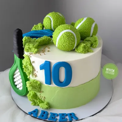 A cake for a lawn tennis player. This sporty design features a tennis racket, edible tennis balls, and a vibrant green and white color scheme.