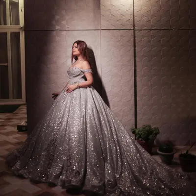 For our engagement announcement shoot, I wanted a true princess moment. This magnificent silver ball gown made me feel like I was living in a fairytale, a perfect example of creating dramatic and memorable pre-wedding content.
