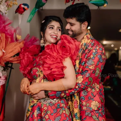 The happy couple, Aditi and Yashas, at their vibrant Mehendi ceremony. We used a riot of colors, with custom parrot props and a backdrop full of tassels and flowers.