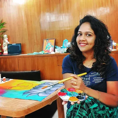 A happy moment in my workspace. With my palette in hand and a canvas in front of me, I feel most like myself. For me, painting is a source of joy and a way to connect with others through art.