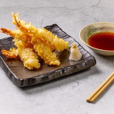 Our Prawn Tempura is a guest favorite, celebrated for its golden, crispy, and feather-light batter. Served with a traditional dipping sauce, it’s a classic Japanese dish executed to perfection.