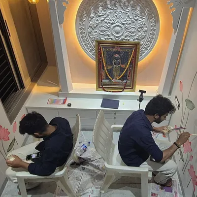 Here, my colleague and I are deep in the process of painting the lotus and Kamdhenu mural. Working in a sacred space requires focus and a meditative approach to each detail.