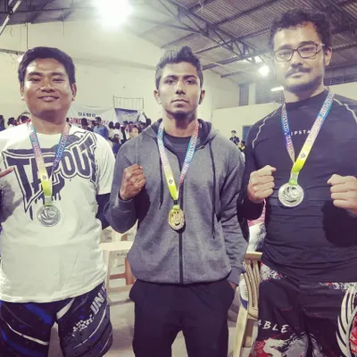 Our fighters on the podium at a national BJJ competition. We brought home two silvers and a gold. It's not about winning, but about how you perform. I'm a proud coach.