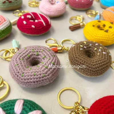 A sprinkle of sweetness for your keys. Our donut crochet keychains come in various "flavors" with different colored icing and sprinkles. They are a fun, calorie-free treat for any donut lover.