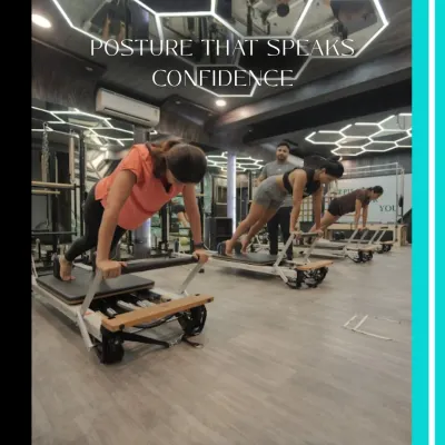 A strong core creates posture that speaks confidence. This group is holding a plank variation on the reformer, a challenging exercise that strengthens the entire core musculature.