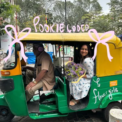Pookie coded. A cute moment in a classic Bengaluru auto-rickshaw, made even better with some flower-girl doodles.