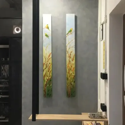 This is the finished look for our office pillar project. We installed two vertical canvas paintings featuring birds in a wheat field, which complements the new grey textured wall finish.