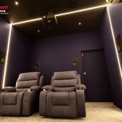 This 7.1.2 home cinema in Madurai demonstrates how a smaller space can be transformed into a powerful theater. The deep purple acoustic walls and clean LED light strips create a modern, minimalist look.