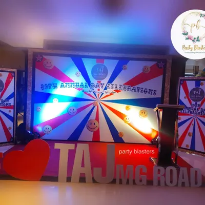 We design and execute bold stage setups for major corporate events, like this one for the Taj MG Road's annual day celebration. The design features large, custom 3D lettering and a vibrant, branded backdrop to create a high-energy focal point for the festivities.