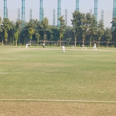 A wide view of a competitive match in progress at our grounds. We provide a professional playing environment to simulate the experience of high-level cricket tournaments.