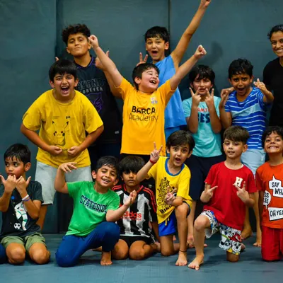 This is the spirit of Warrior's Cove. A group of our Little Warriors, full of energy and confidence after a great training session with their coach.