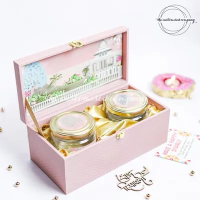 This elegant pink box, with its intricate 3D palace design, opens to reveal two jars of premium dry fruits. It's a perfect example of how I blend traditional motifs with contemporary luxury for a memorable Diwali gift.